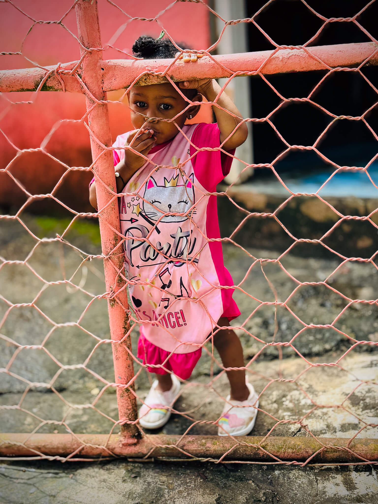 Rescued Movie behind the scenes - Little girl behind a fence